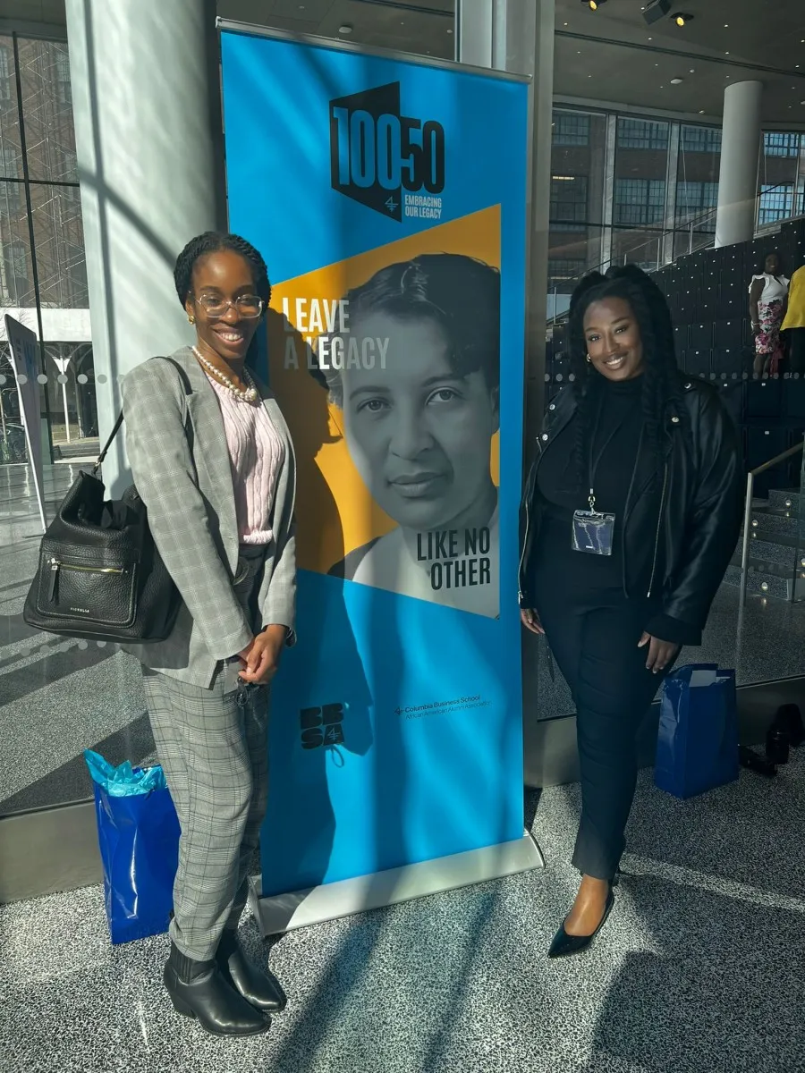 Two woman with poster