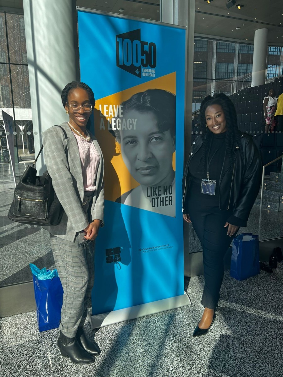 Two woman with poster