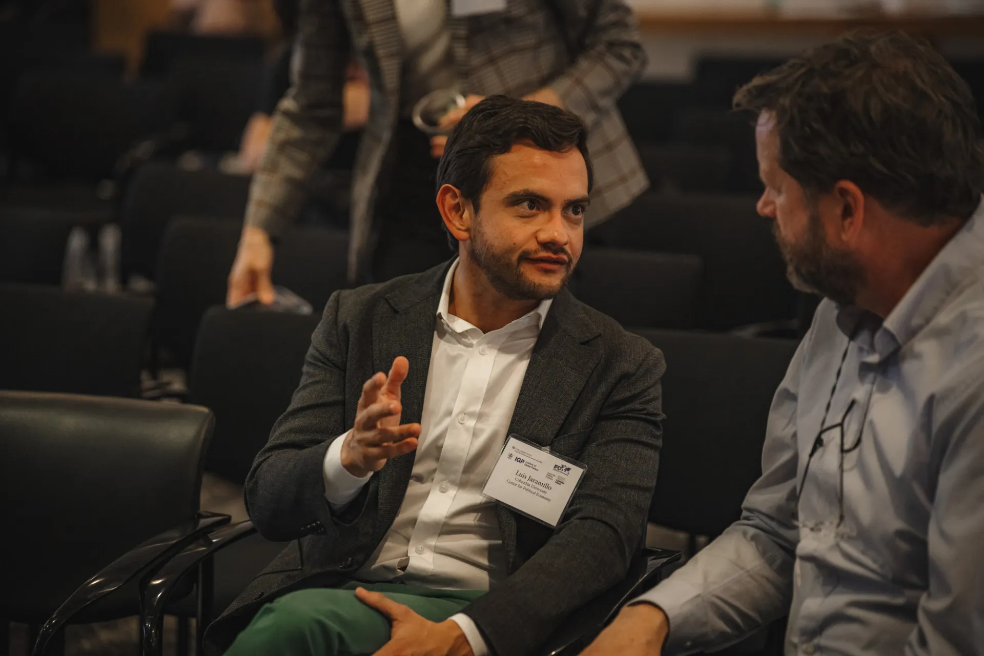 Conversation in the audience.