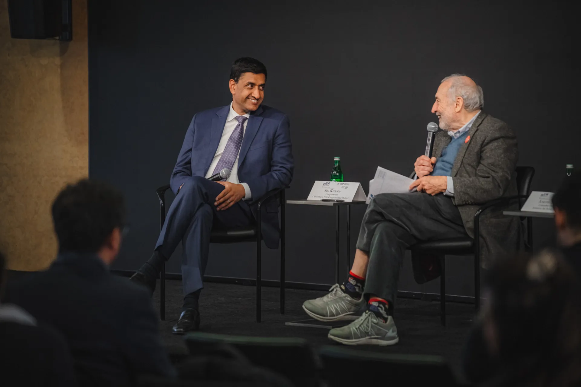 Two men conversing.