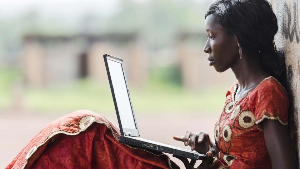 Woman with laptop.