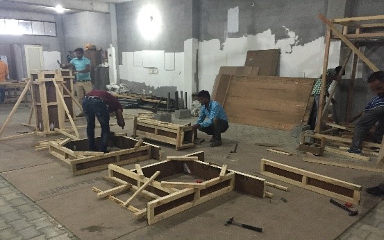 Prospective migrant workers doing simple construction skills test.